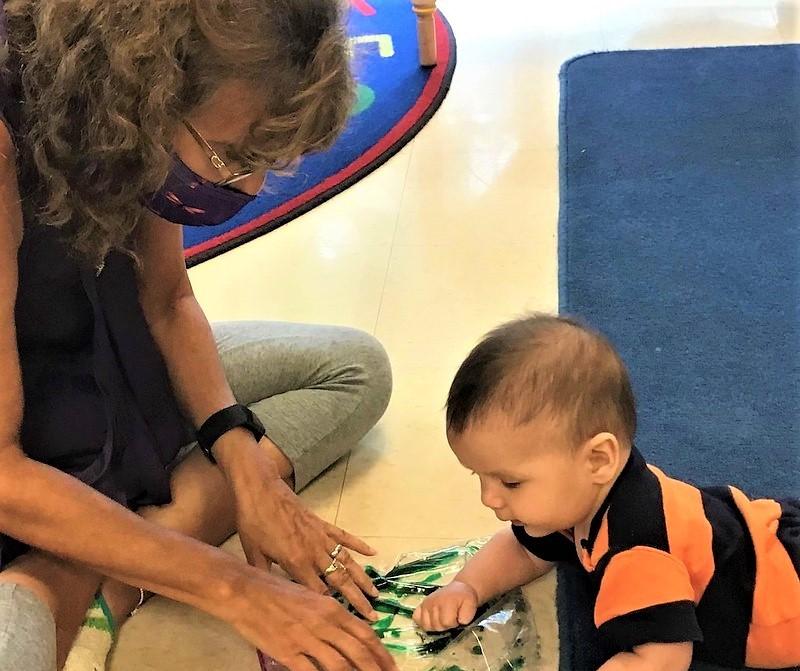 Childcare worker with baby