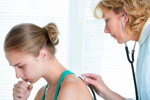 Coughing patient with doctor