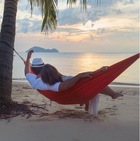 Couple in hammock in the tropics