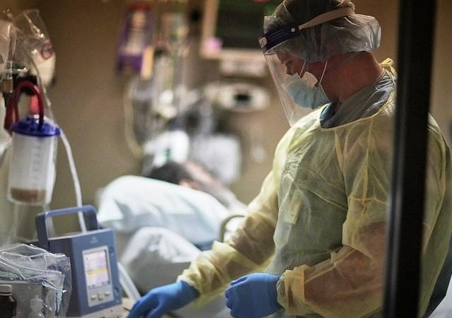 Doctor at bedside of COVID-19 patient