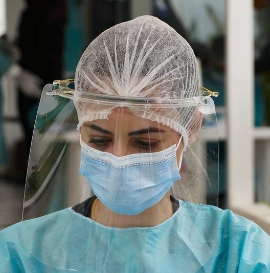 Health worker with face shield in Brazil