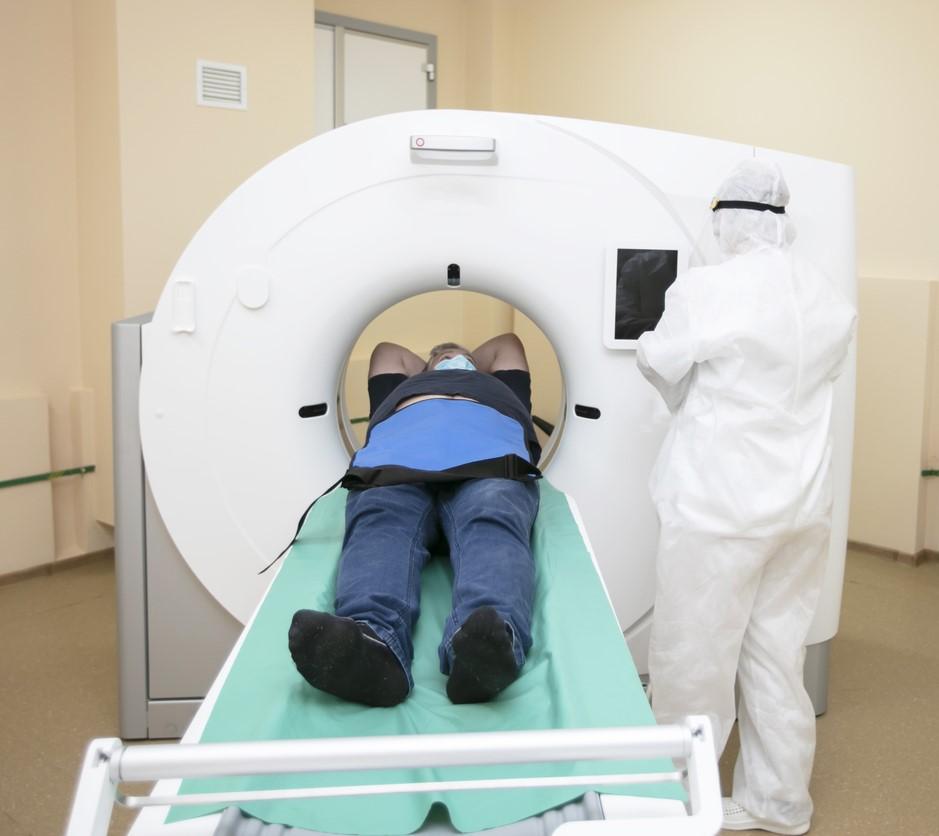 Man wearing mask getting an MRI