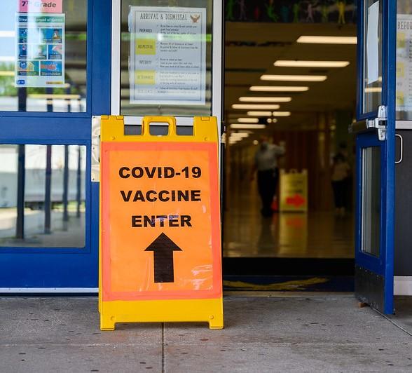 "COVID-19 Vaccine Enter" sign