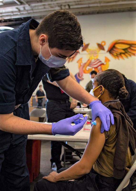 Young woman getting COVID vaccine