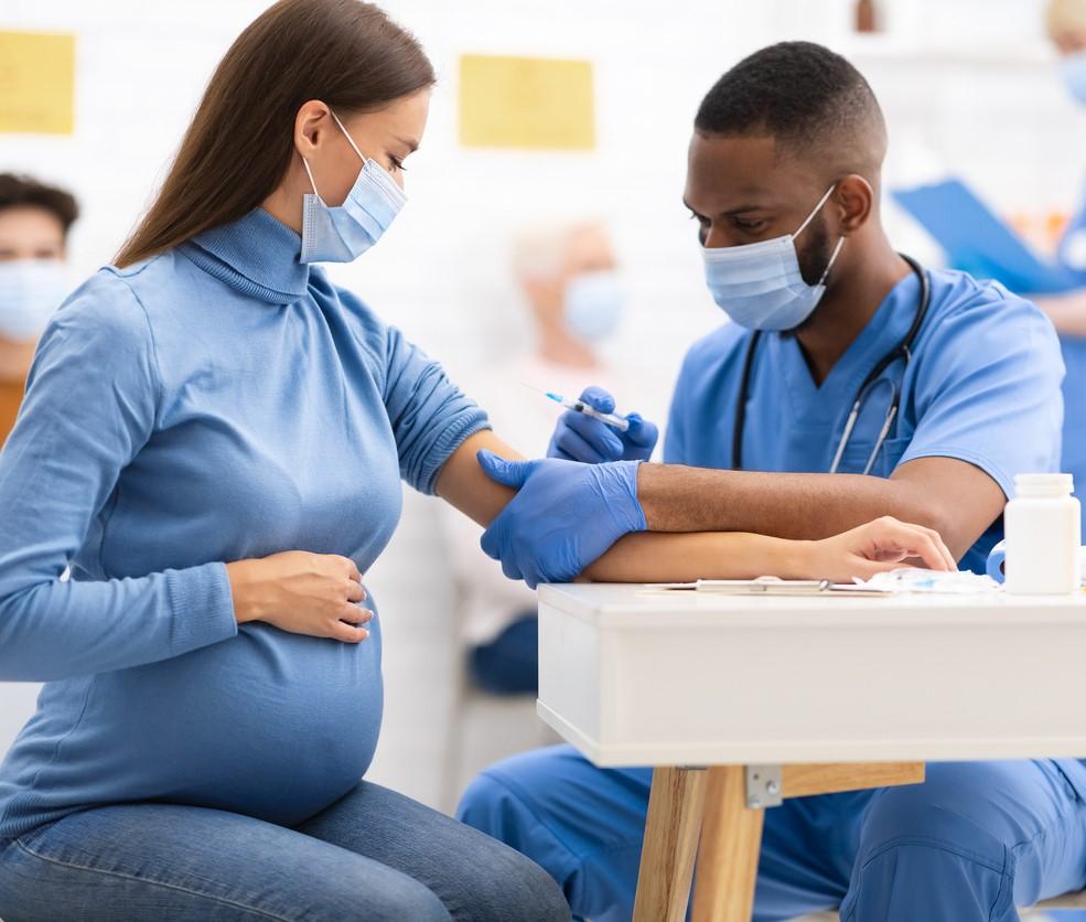 Pregnant woman getting COVID-19 vaccine