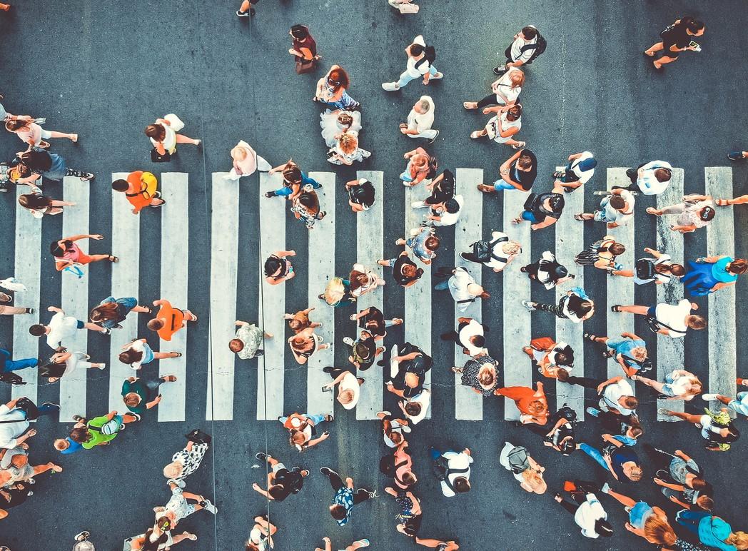 Aerial view of many people in crosswalk