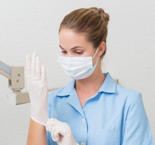 Dental assistant wearing mask