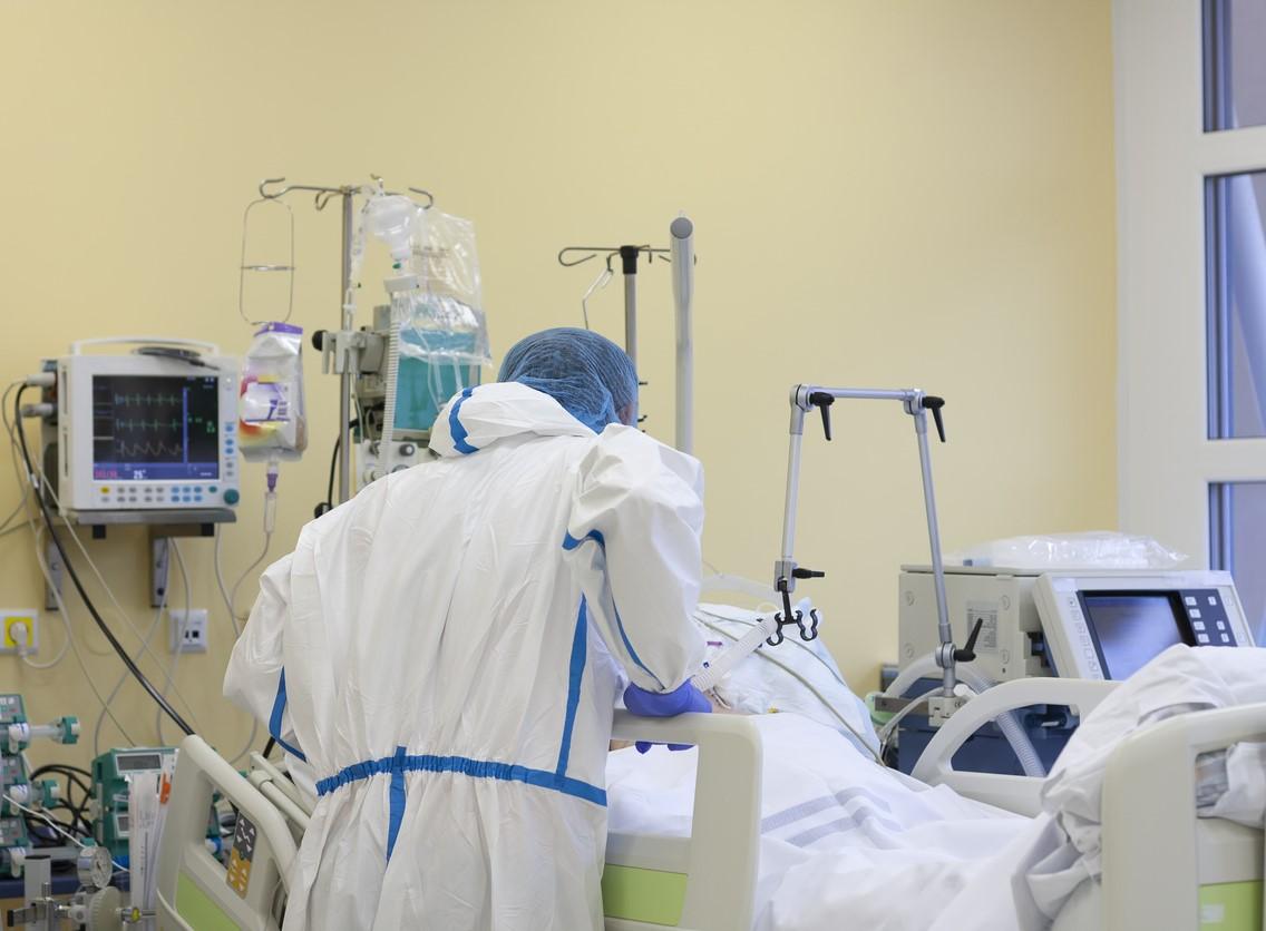 Healthcare worker at patient's bedside