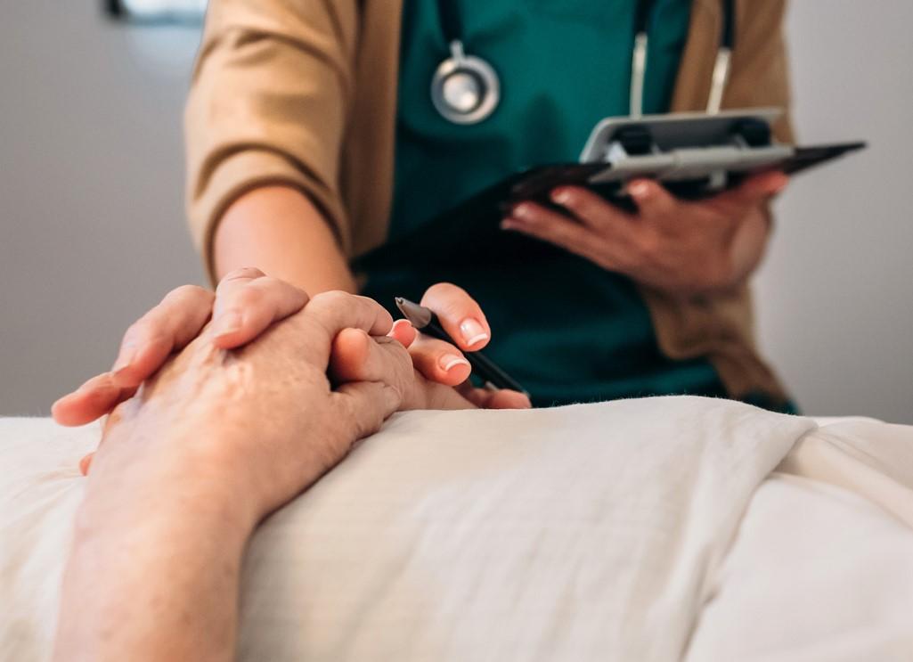 Doctor comforting patient