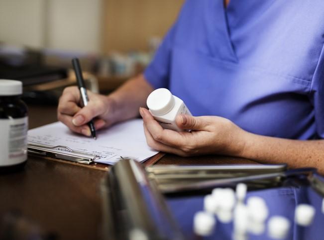 Doctor writing prescription