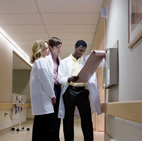 Doctors consulting in hallway