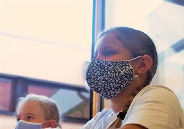 Dutch schoolgirls wearing masks