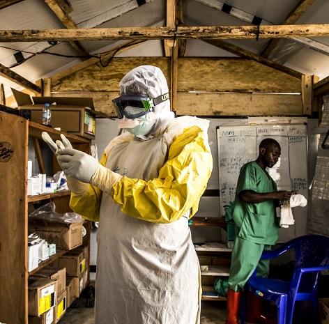 Ebola health worker donning gloves