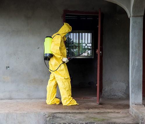 Ebola worker disinfecting