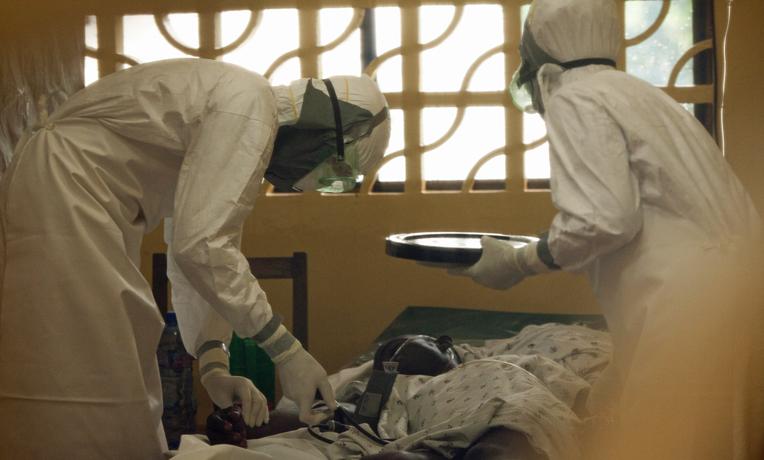 Workers care for Ebola patients