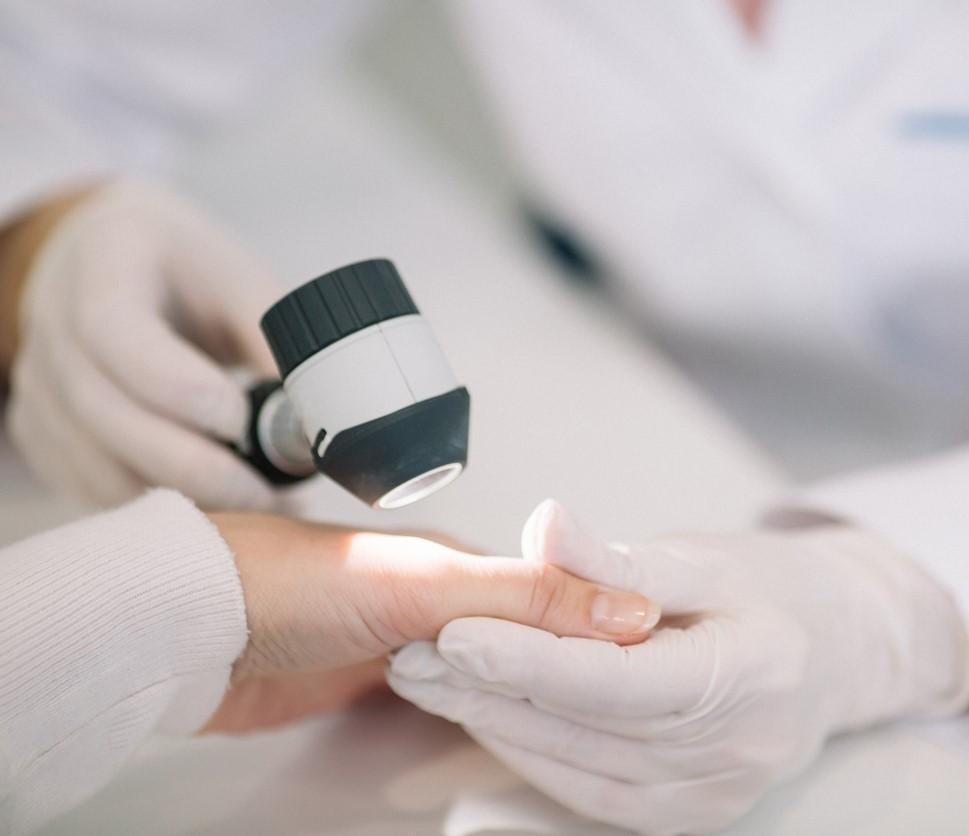 Examining hand of patient