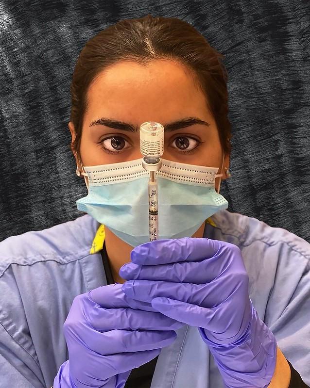 Pharmacist dosing the Pfizer COVID vaccine