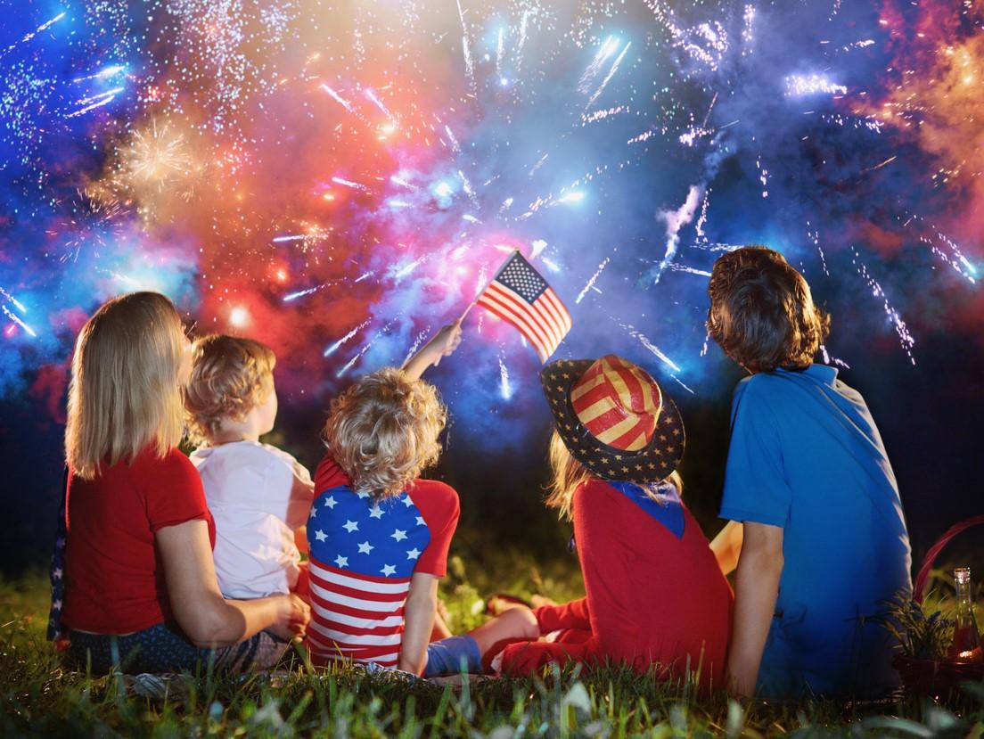 Family watching 4th of July fireworks