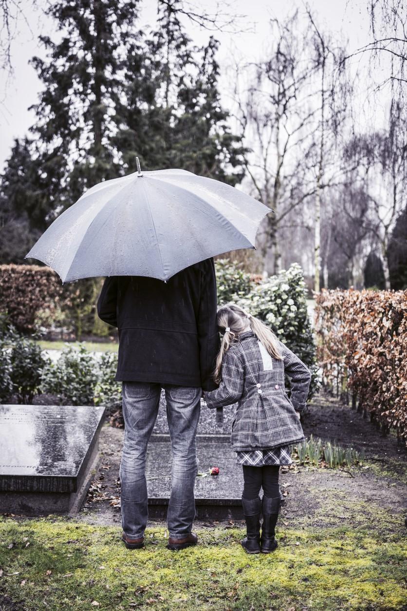 Father and daughter at graveside