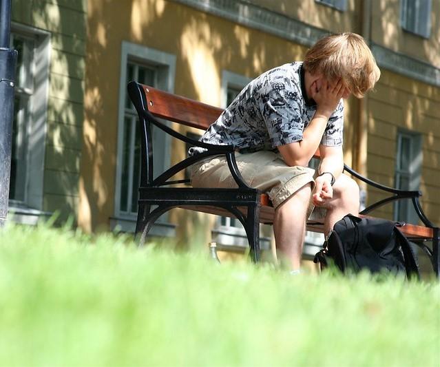 Fatigued man on park bench