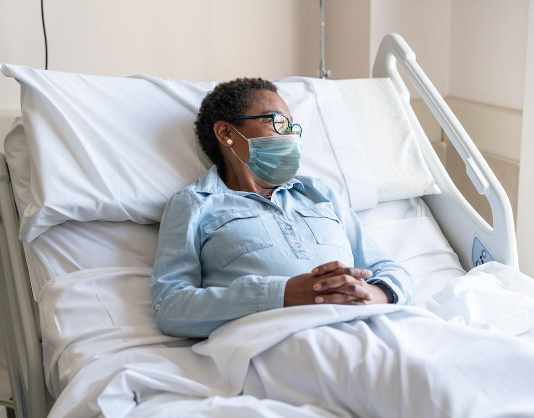 Female hospital patient wearing mask