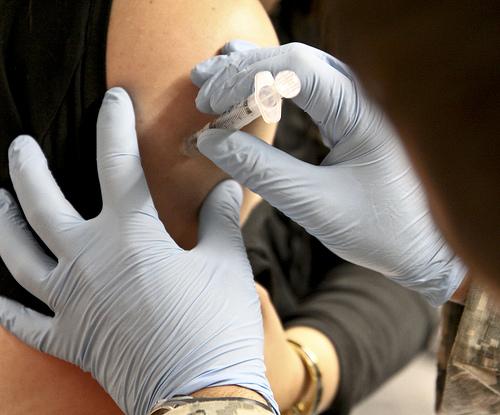 Flu vaccine being injected
