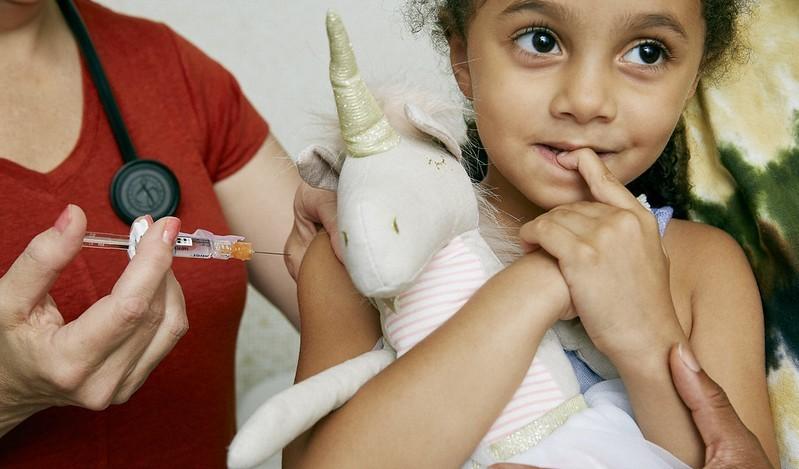Girl getting vaccinated