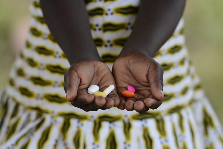 Girl in Africa with pills