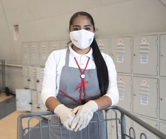 Grocery worker wearing mask