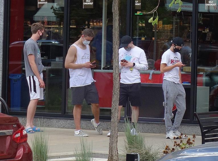 Group of college men on phones