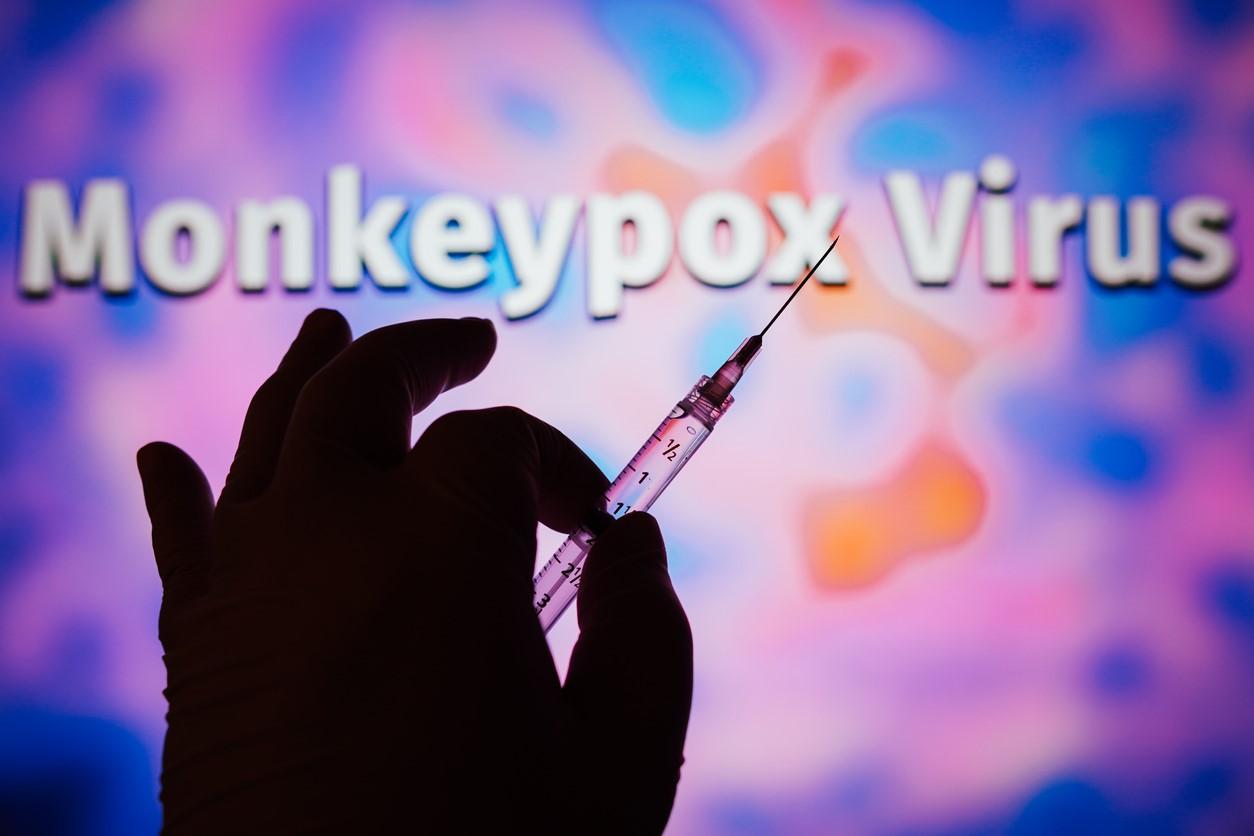 Hand holding monkeypox vaccine syringe