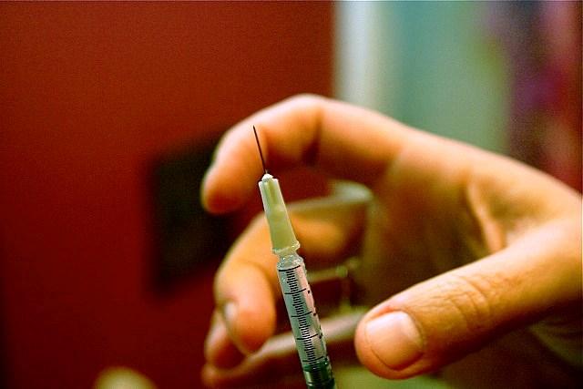 Hand with syringe