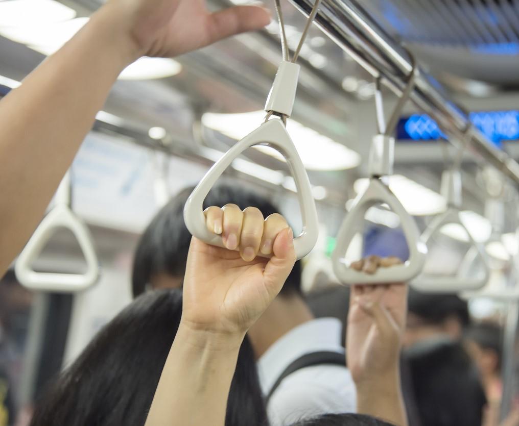 Hands on subway straps