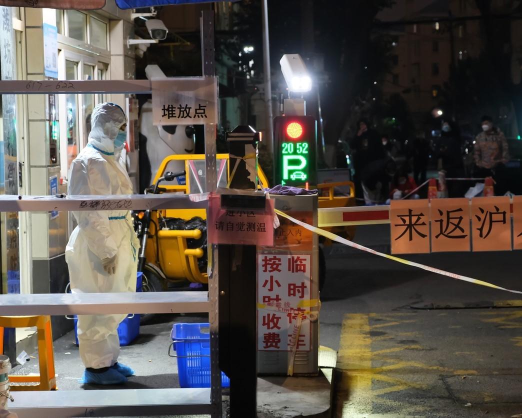 Shanghai healthcare worker at night wearing full PPE