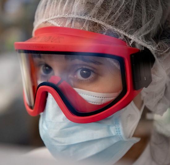 Healthcare worker wearing goggles and masks
