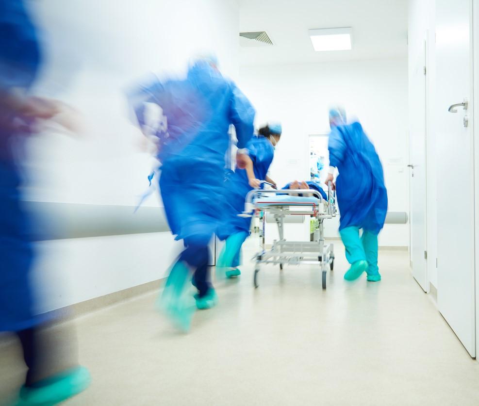 Healthcare team rushing in corridor