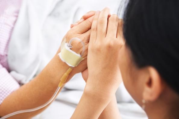 Holding patient's hands