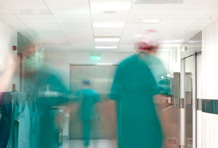 Hospital corridor with blurry doctors