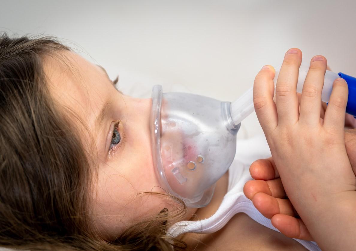 Hospitalized girl getting respiratory support