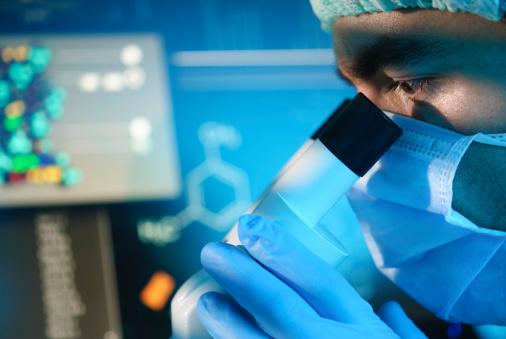 Scientist with microscope