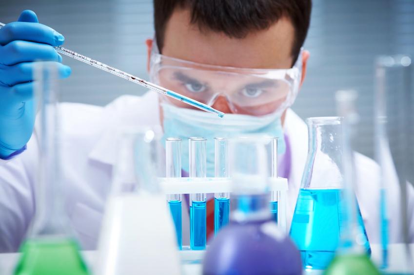Lab worker with test tubes