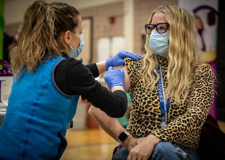 Woman getting COVID-19 vaccine