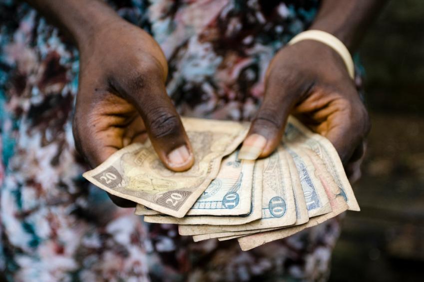 Paper money in a person's hands
