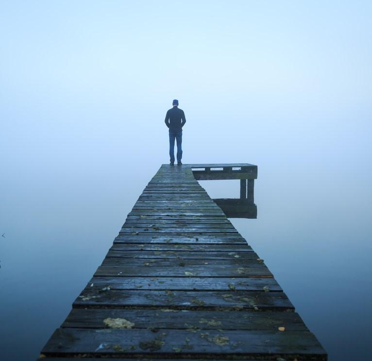 Lone person at end of dock