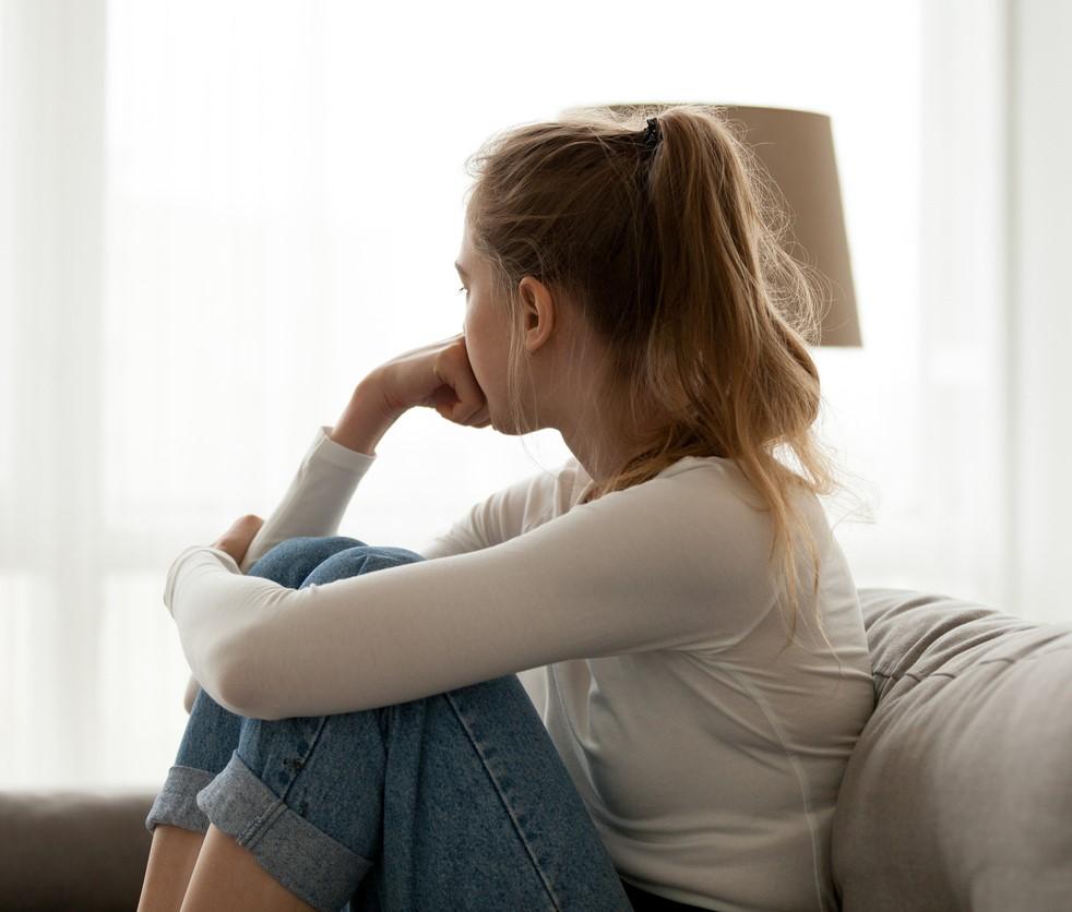 Lonely girl on couch
