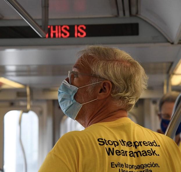 Man wearing mask on bus