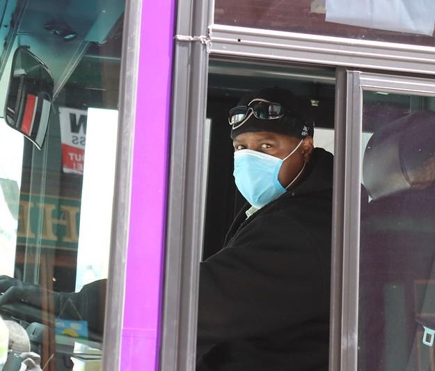 Bus driver wearing surgical mask