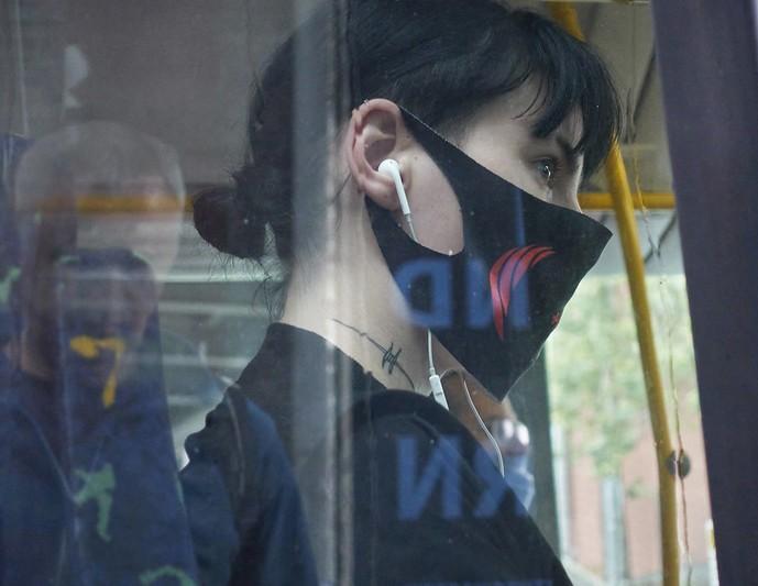 Masked bus passenger
