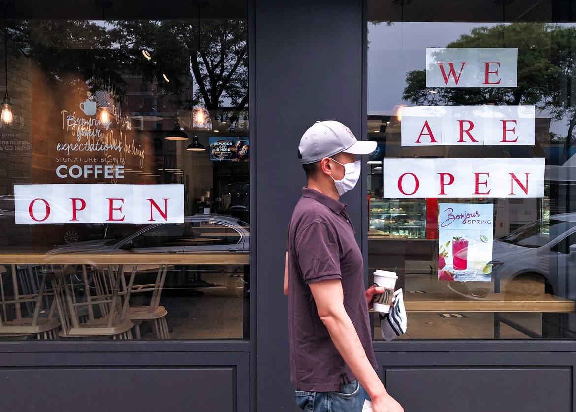 Masked coffee shop customer