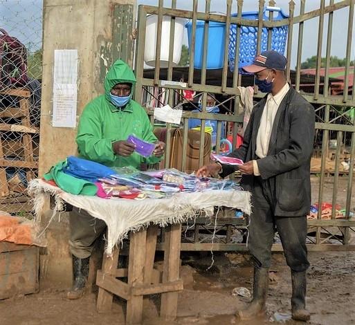 Masked seller and buyer in Kenya